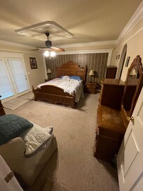 Master bedroom with French doors on left leaking water from rain.