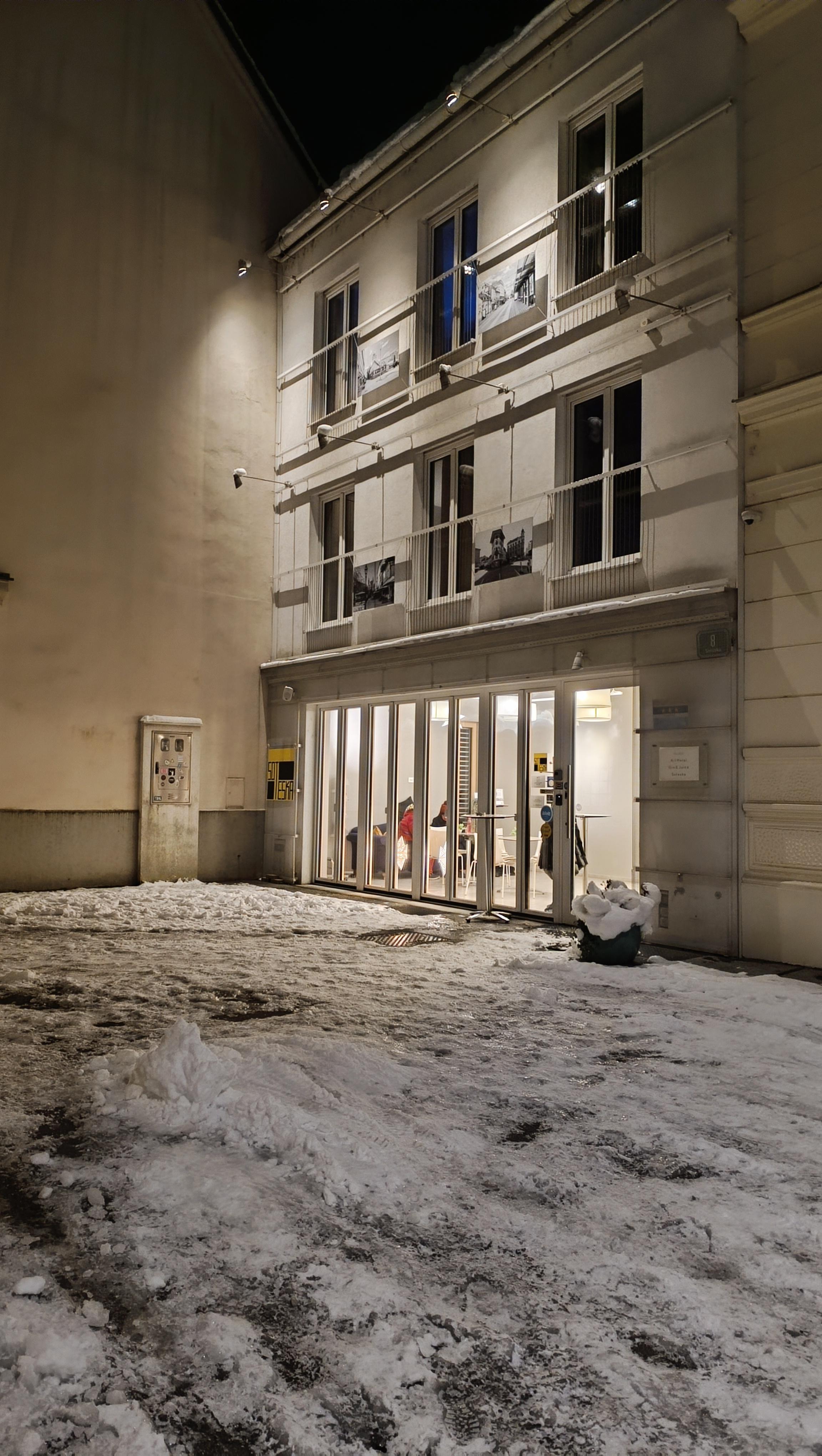 Hotel front at night.