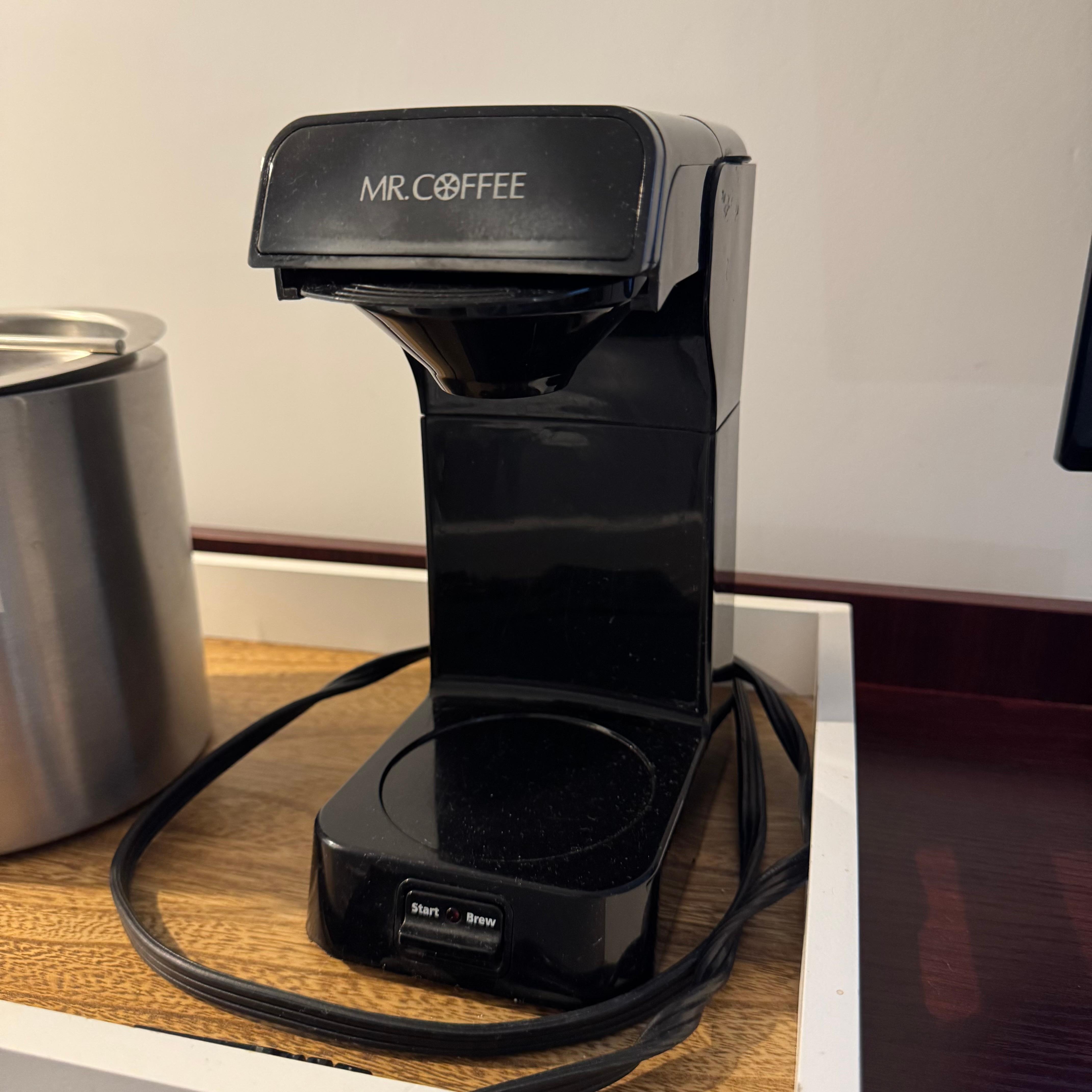 Coffee machine with no coffee and no cups.