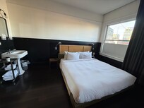 King suite bed! The windows here can be covered by floor length room darkening curtains