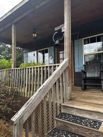 Front porch area where you could have your morning coffee and watch the hummingbirds