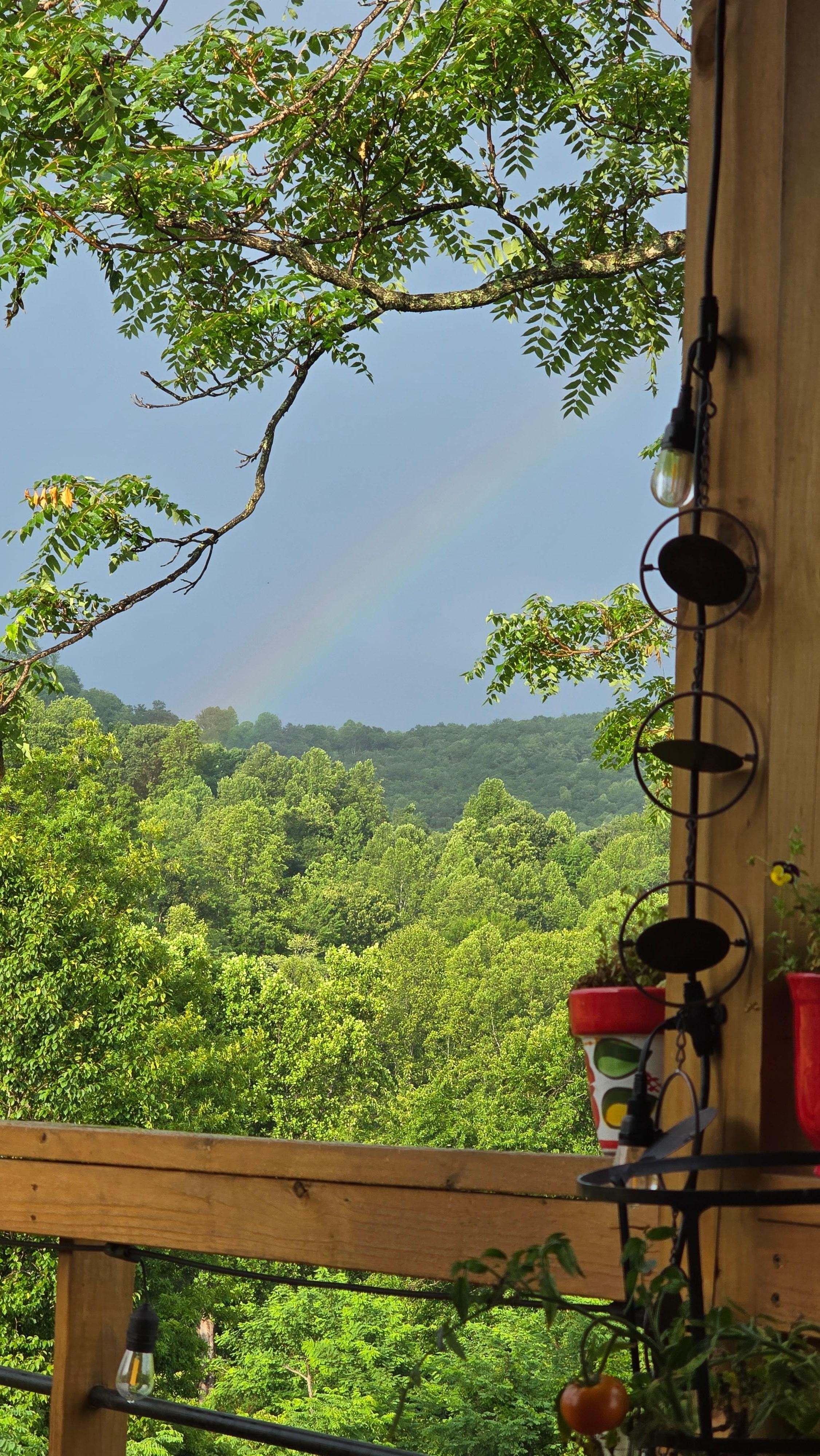 Rainbow after the rain, view from the front porch.