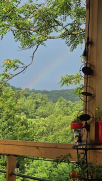 Rainbow after the rain, view from the front porch.