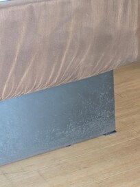 Dirty and stained around the bed