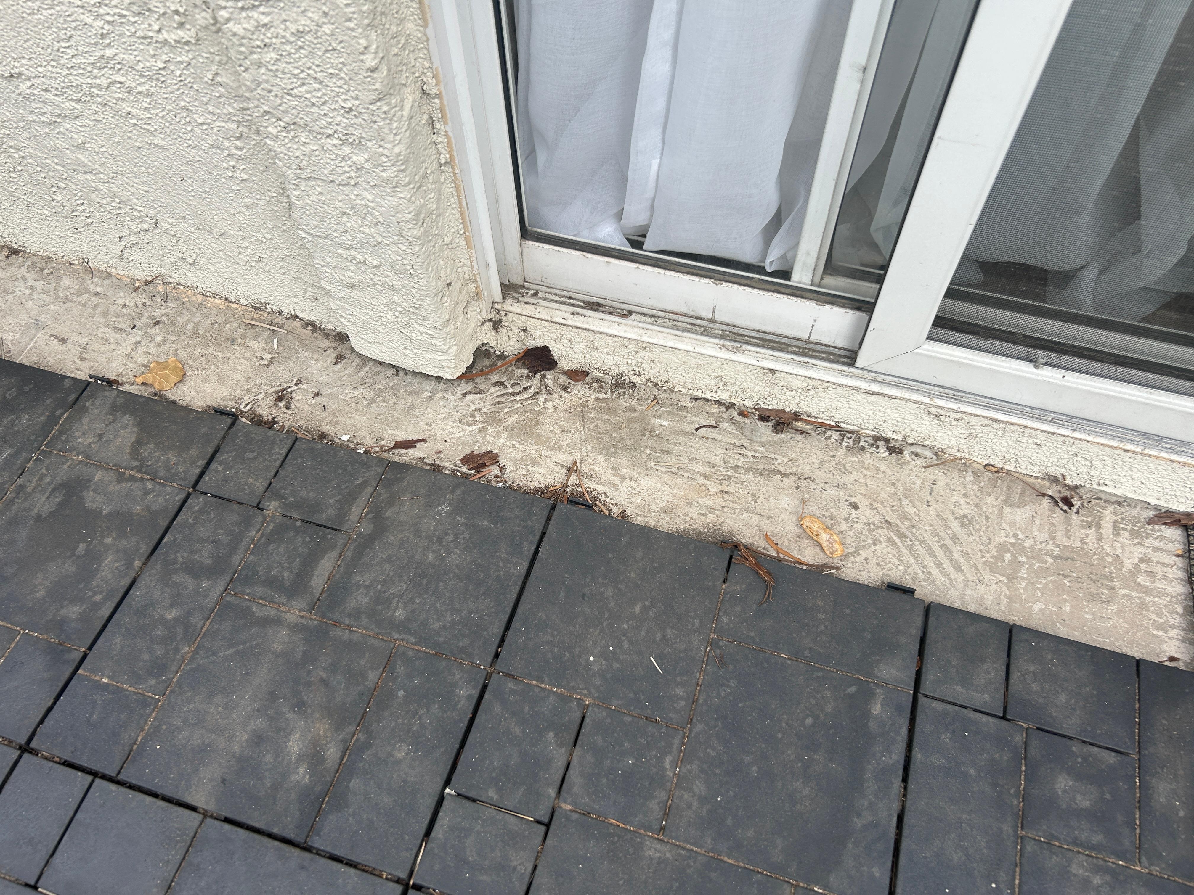 Dirty unswept areas around outside of condo