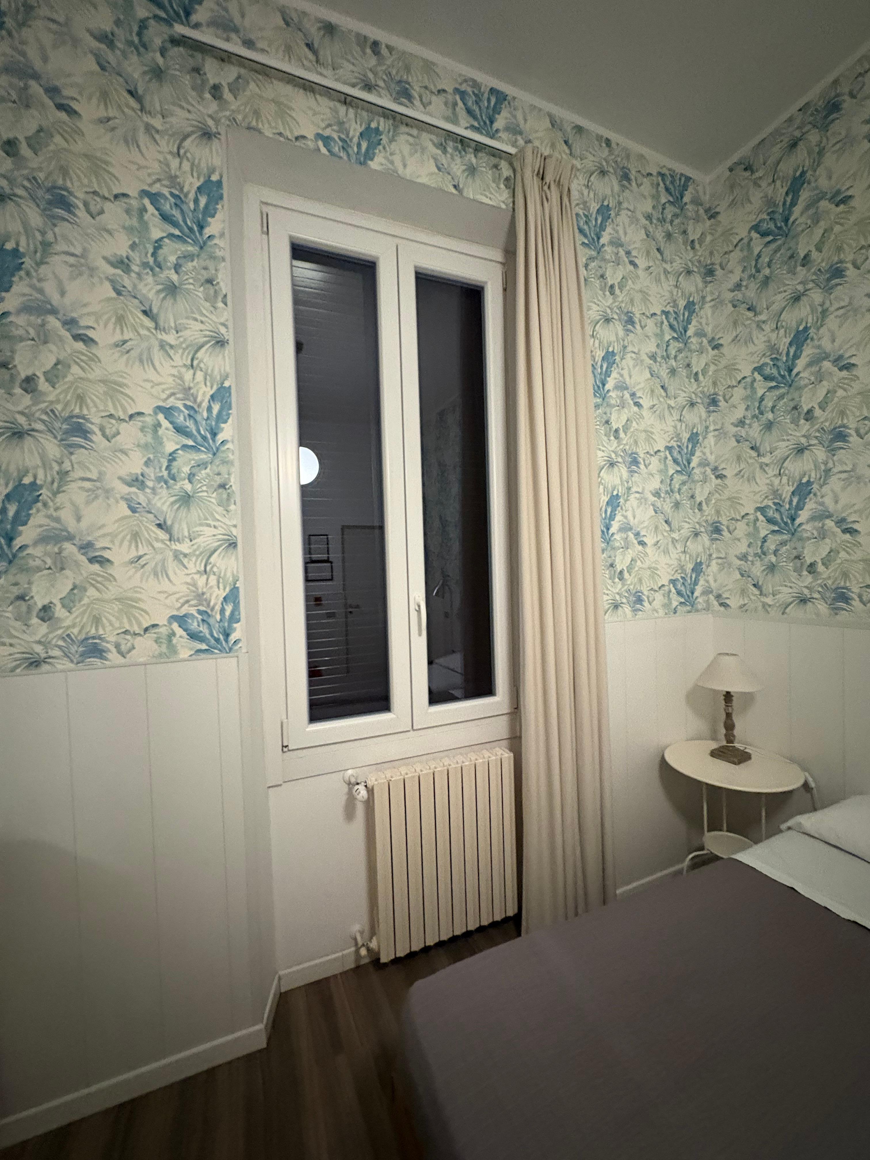 Window to the street.Secure with bars. Opens for fresh air. Very quiet at night. No noise at all. 