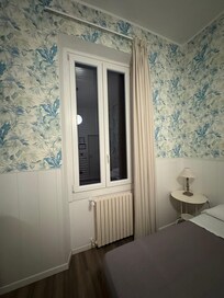 Window to the street.Secure with bars. Opens for fresh air. Very quiet at night. No noise at all.