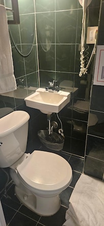 Bathroom, so small you can't stand in front of the sink, have to use it from the side.