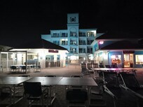 Back of Sand Rose at night. Ola's is the blue building.