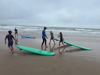 Surf camp is easy to access if you have kids. There’s a truck parked at the park advertising it. It was great.