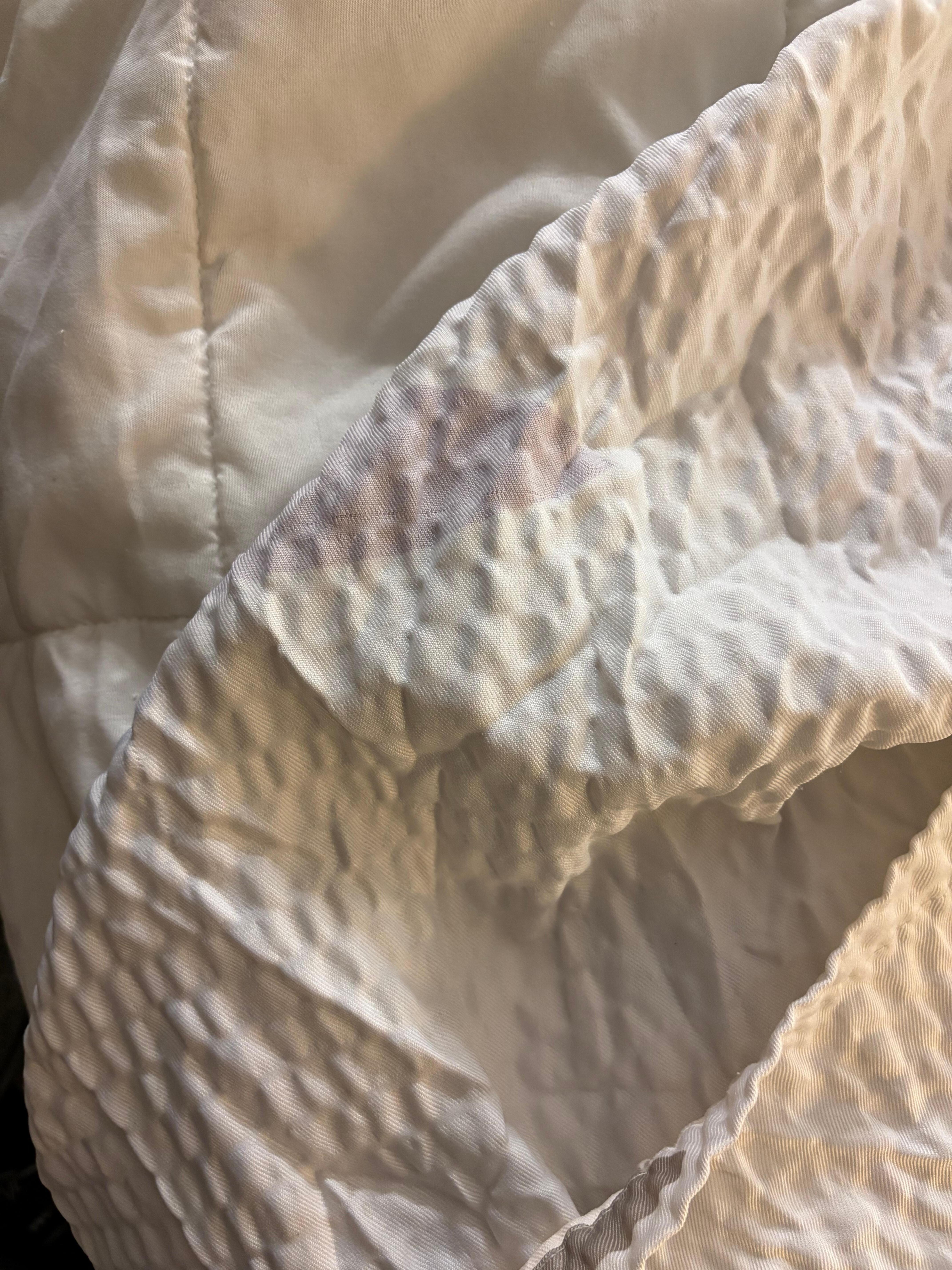 (Cigarette butt?) Hole in sheet