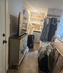 Space between the door and foot of the bed