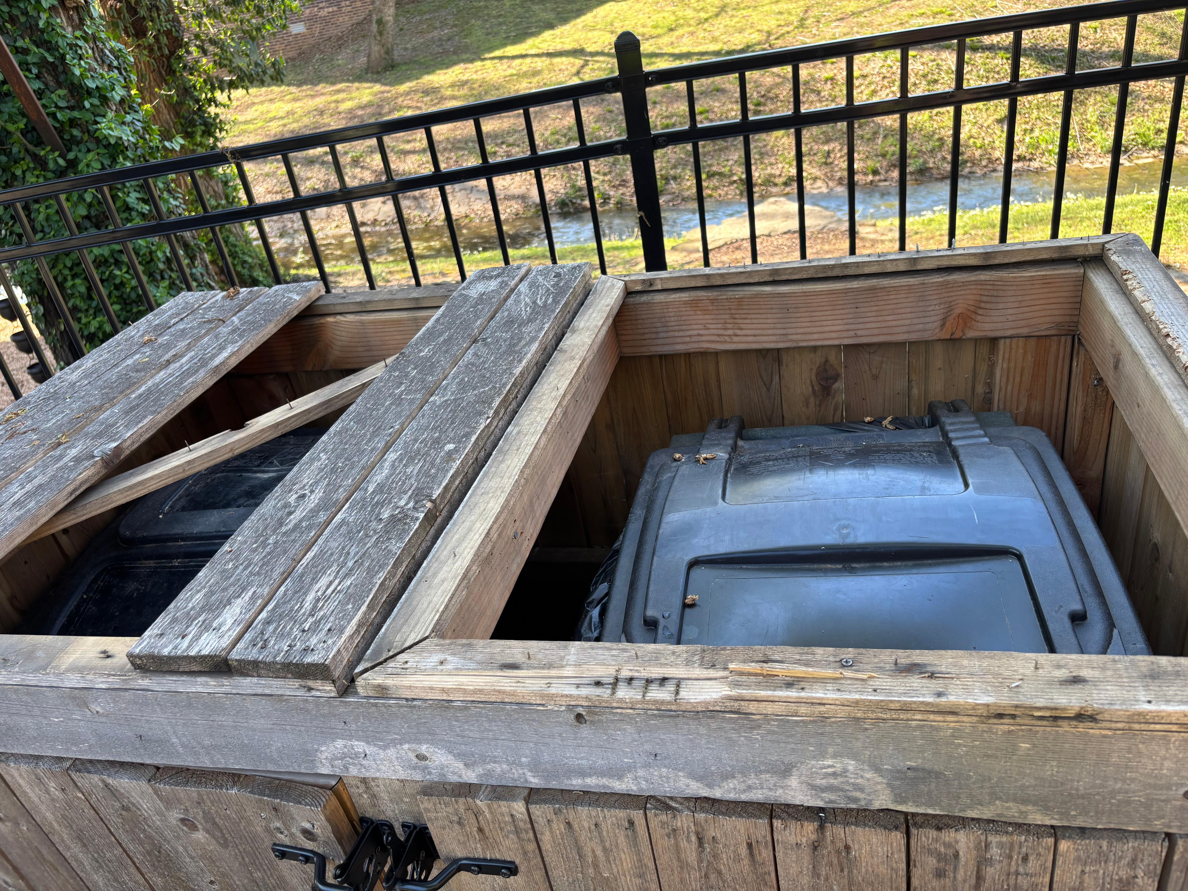 Broken trash can container with exposed nails