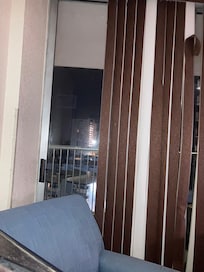 Picture taken at 11:15p. Difficult to sleep due to broken slats in blinds. Night lights shine in the room.