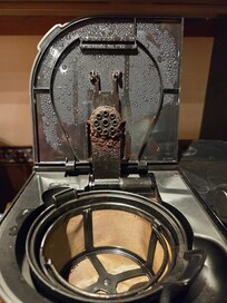 Top of coffee maker that did not get cleaned.