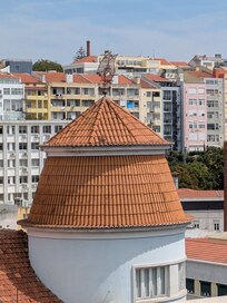 Detail from the view from the rear balcony. The building with the caravel on the roof is a post office branch.