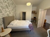 Main bedroom with queen bed and en suite bathroom