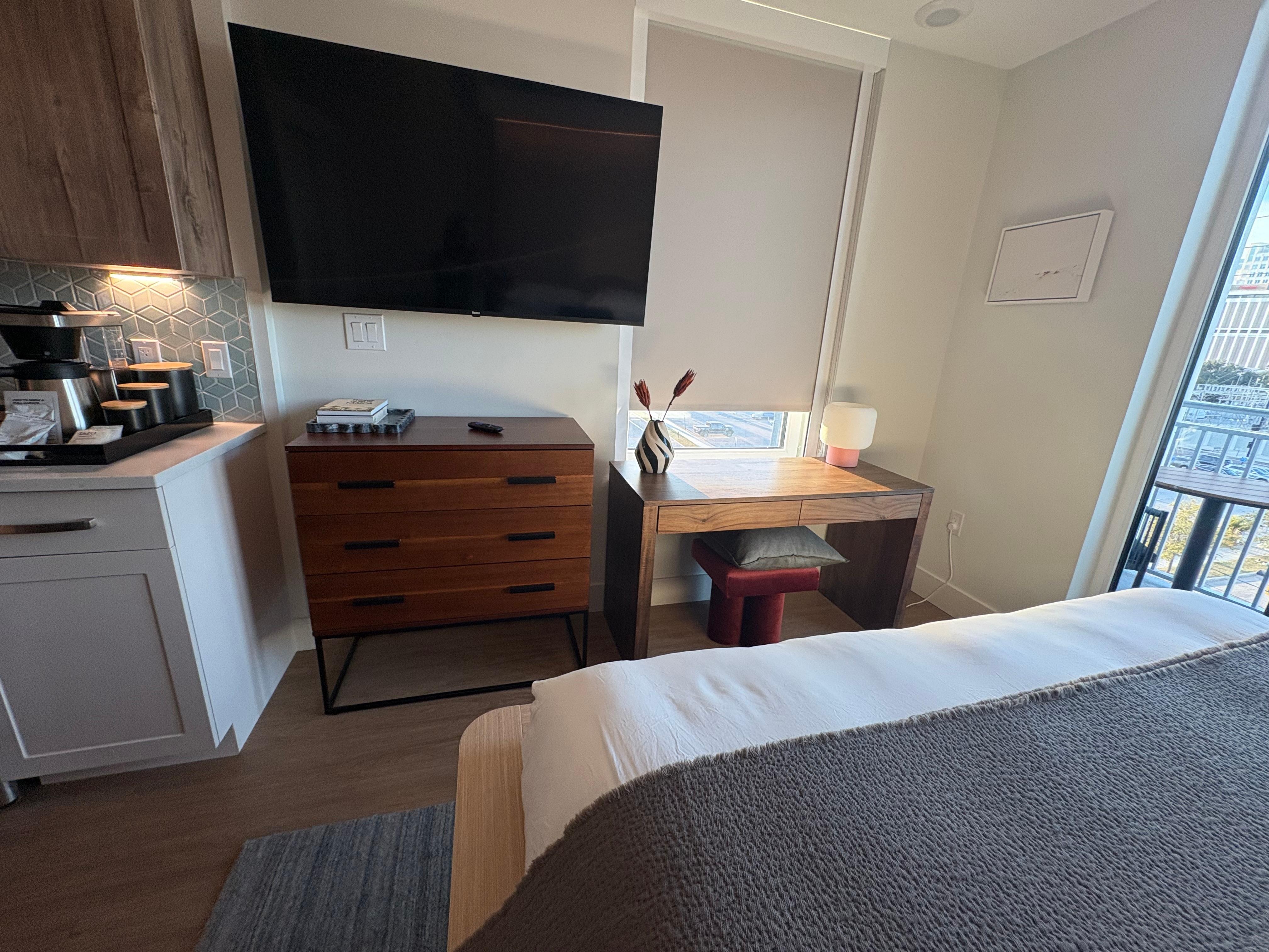 Full size TV. The kitchen has everything one would need. The refrigerator is full size. Beautiful and pristine.