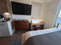 Full size TV. The kitchen has everything one would need. The refrigerator is full size. Beautiful and pristine.