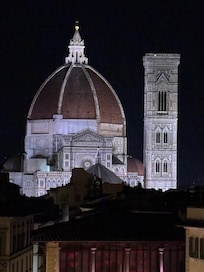 Shot of the duomo at night from rooftop deck