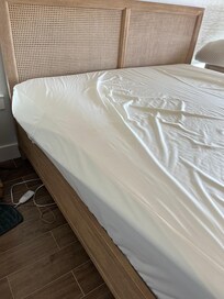 How did the maids make a bed with the topper this far over?