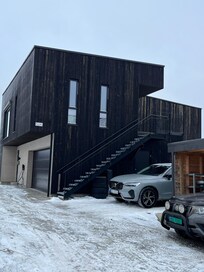 The apartment is on the second floor just up the stairs shown.