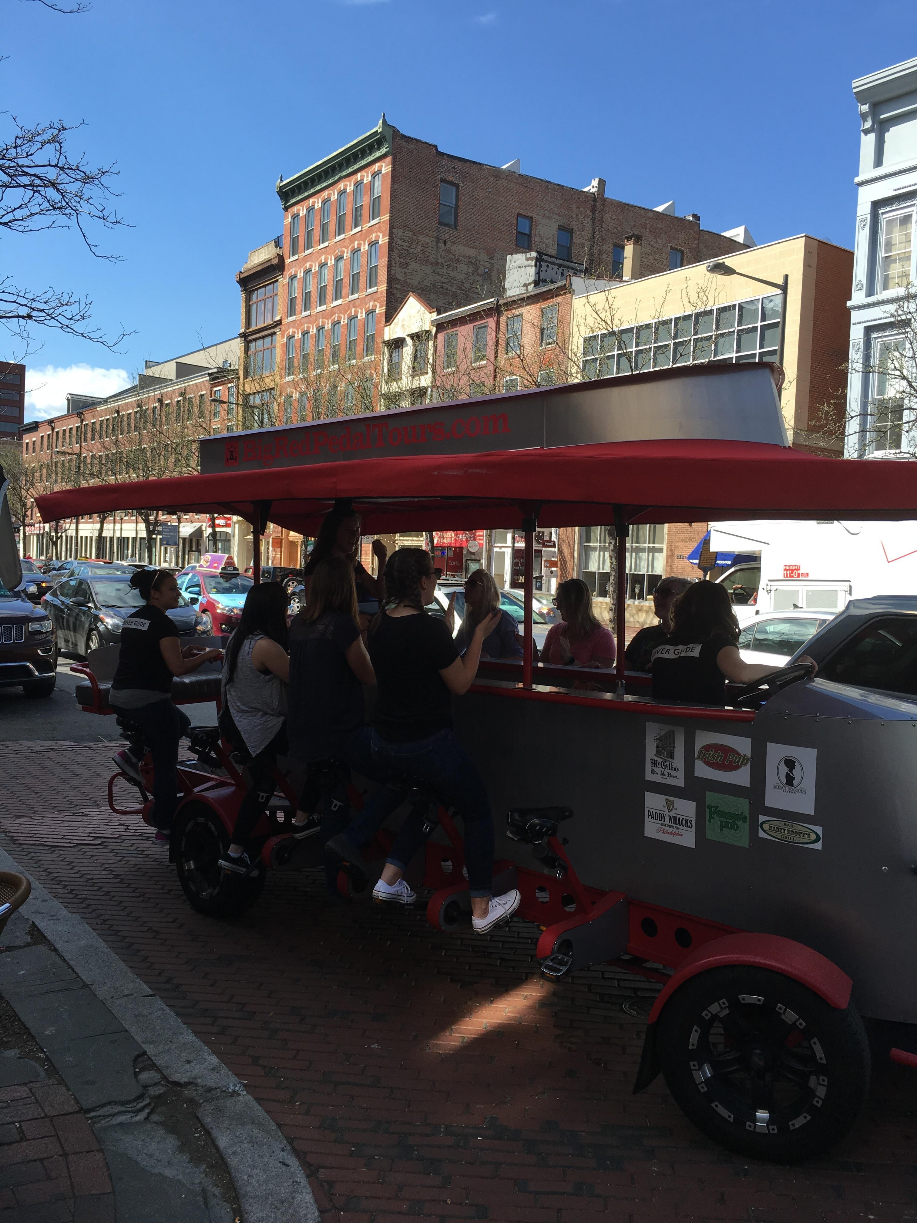 Some people doing the peddle pub tour.