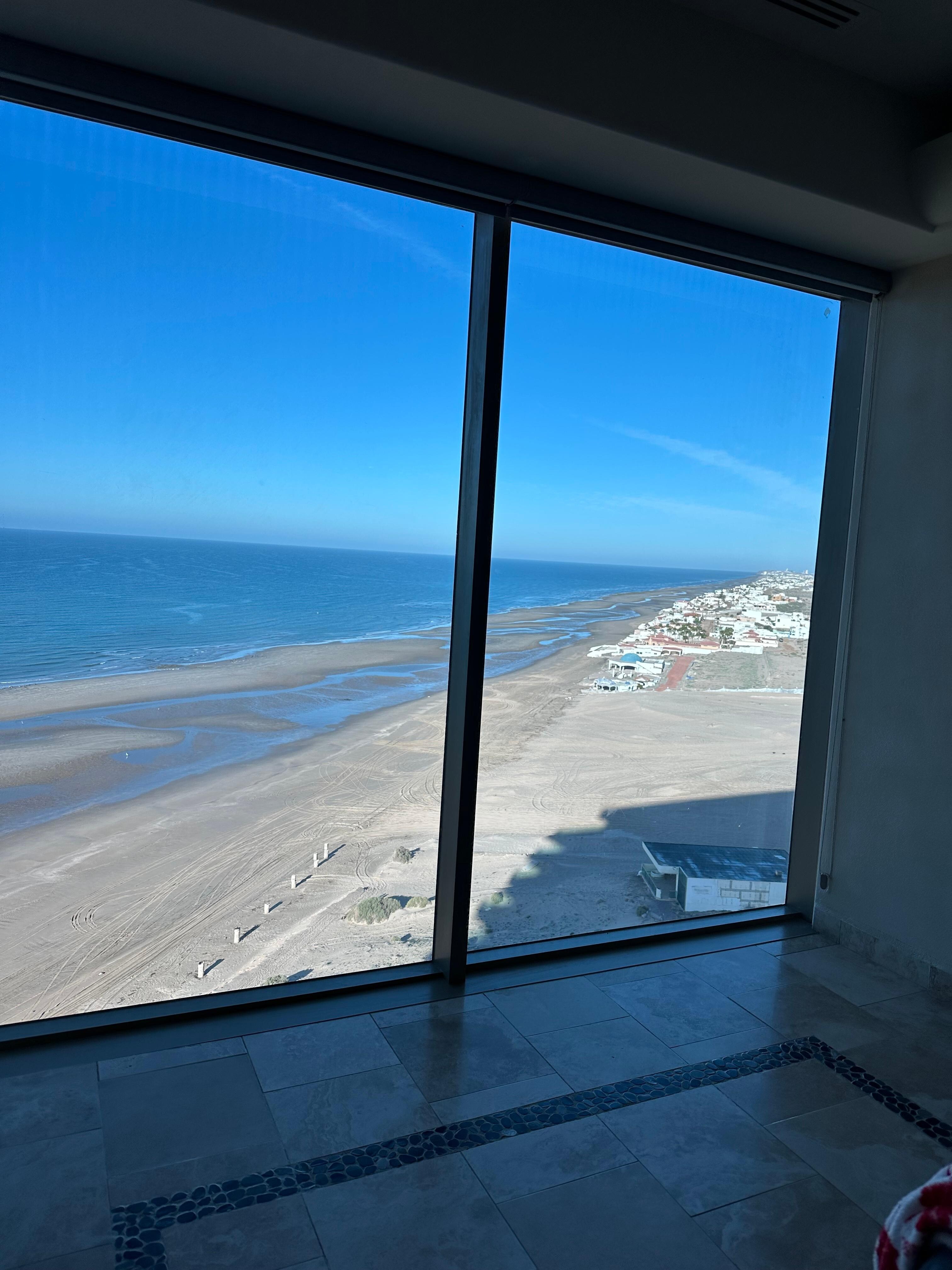 Floor to ceiling windows in Master Bedroom with amazing view. Everyone of the rooms had an ocean view