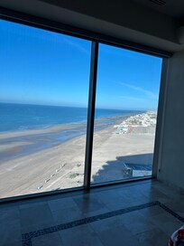 Floor to ceiling windows in Master Bedroom with amazing view. Everyone of the rooms had an ocean view
