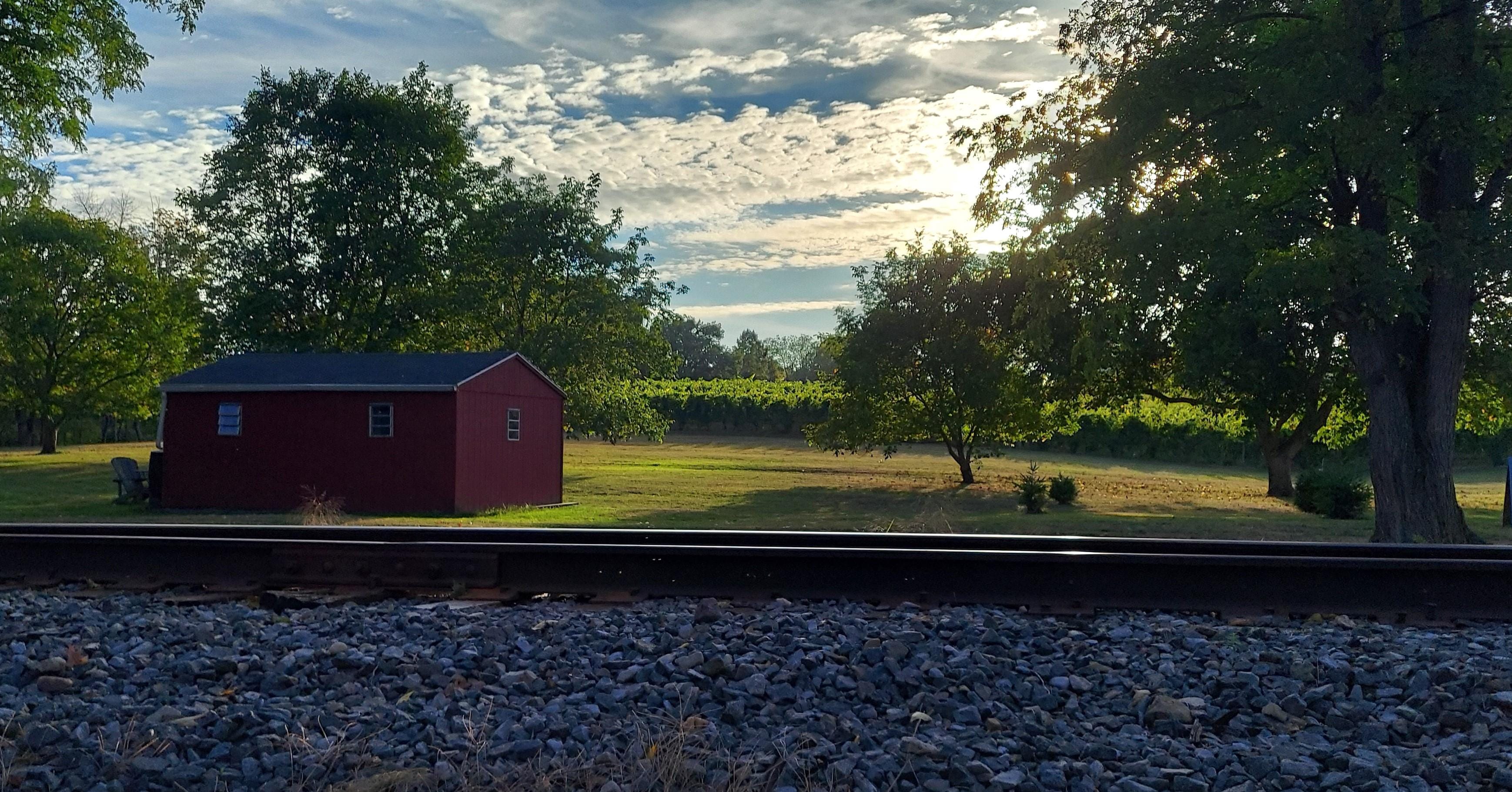 View of the train tracks and the vineyard at sunset