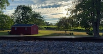 View of the train tracks and the vineyard at sunset