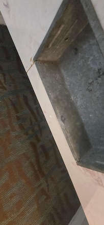 Holder below sink corrosion