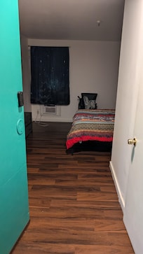 Doors don't really need doorknobs--and the door has a combo lock with no security chain on the inside.