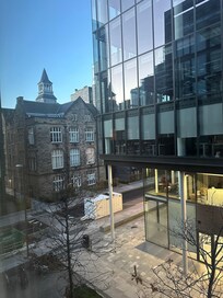 View from my room. It’s opposite an office building but no one is there from dusk.