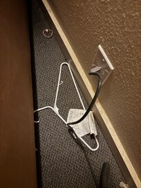 Behind dresser in bedroom