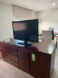 The TV is in a fixed position with limited channels