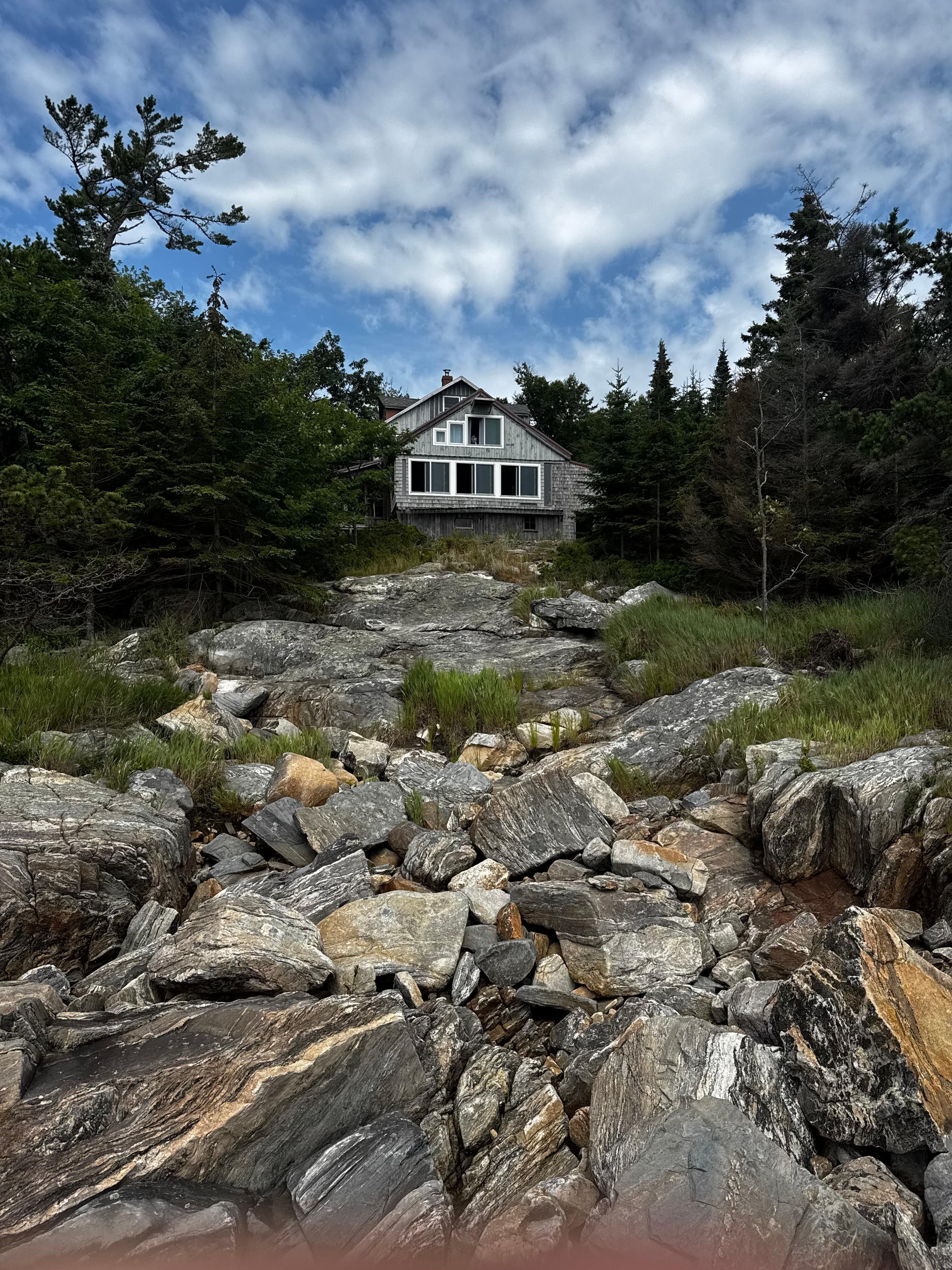 House looking from  rocks below. 