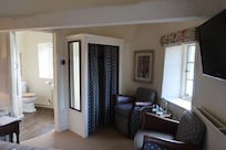 En suite beyond seating area in bedroom