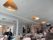 The dining room with very contemporary lights.