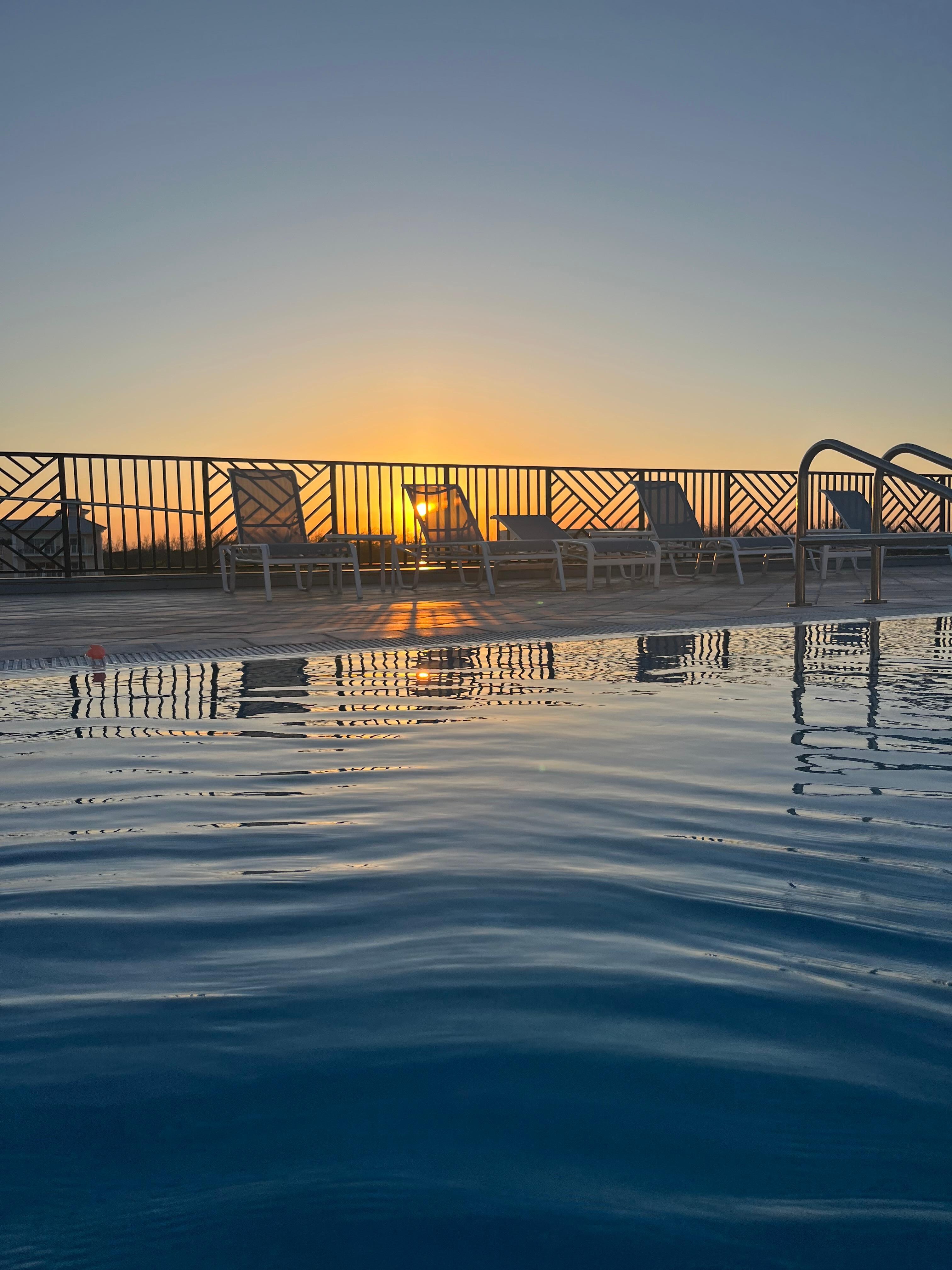Rooftop pool at sunset 