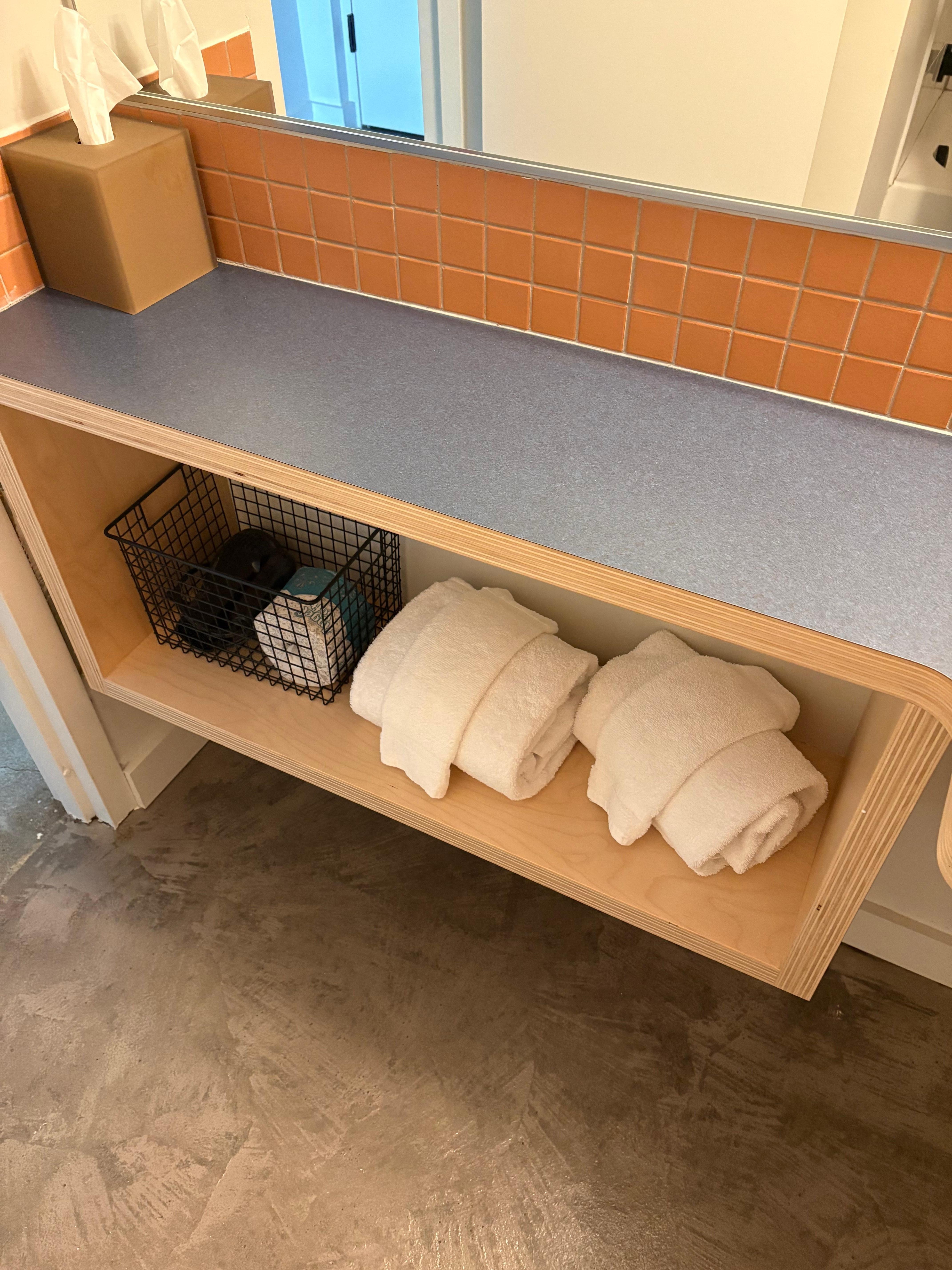 The floors are bare concrete throughout, with a mat rug under the beds. This is a great place to stay near a lot of excellent trailheads; relax into it!