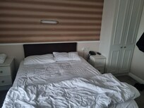 Comfortable double bed in a single room.