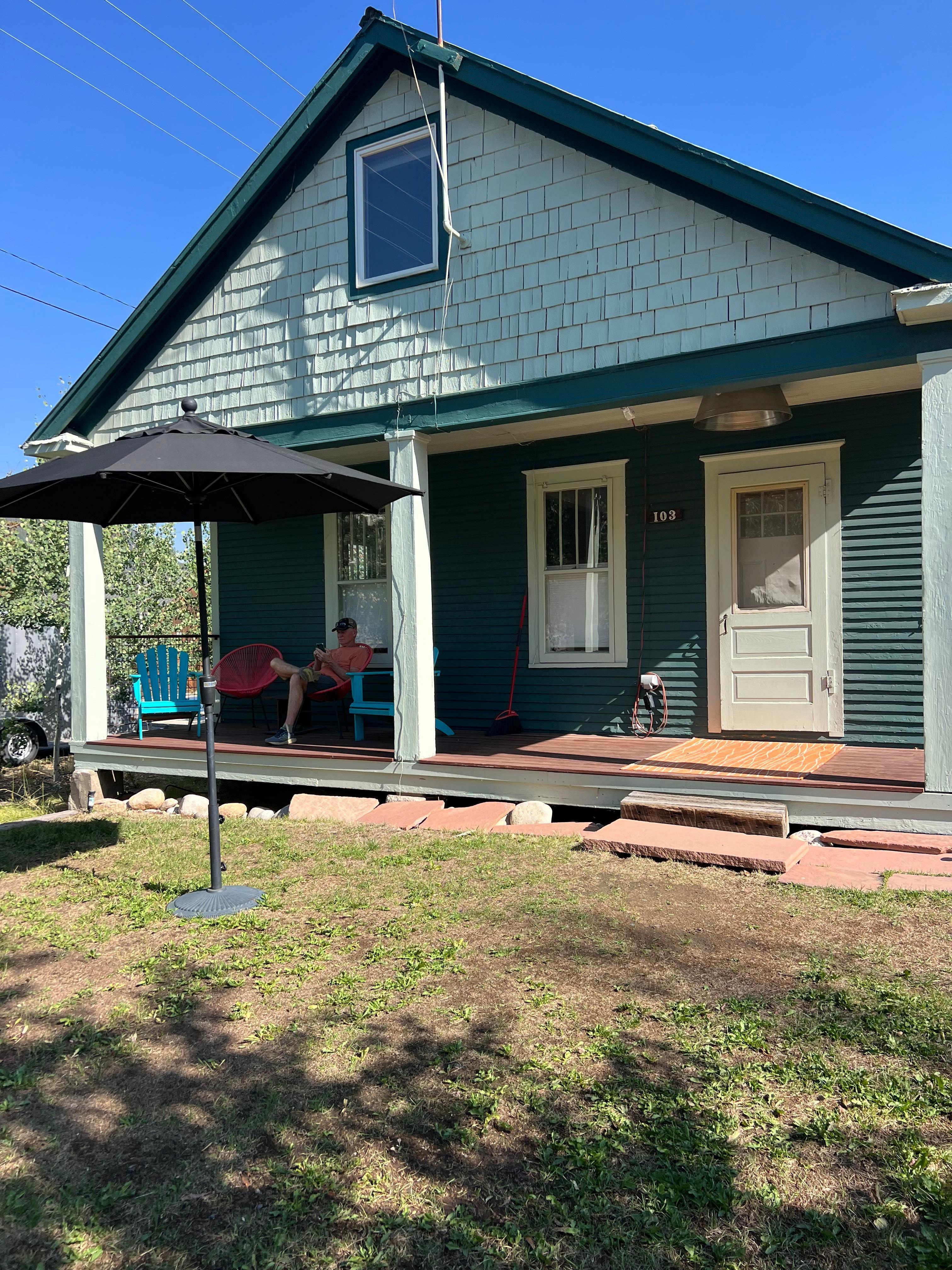 Front of the house, sat on the front porch every morning and evening. 