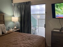 Master bedroom with sliding glass door to patio as well with master bath also