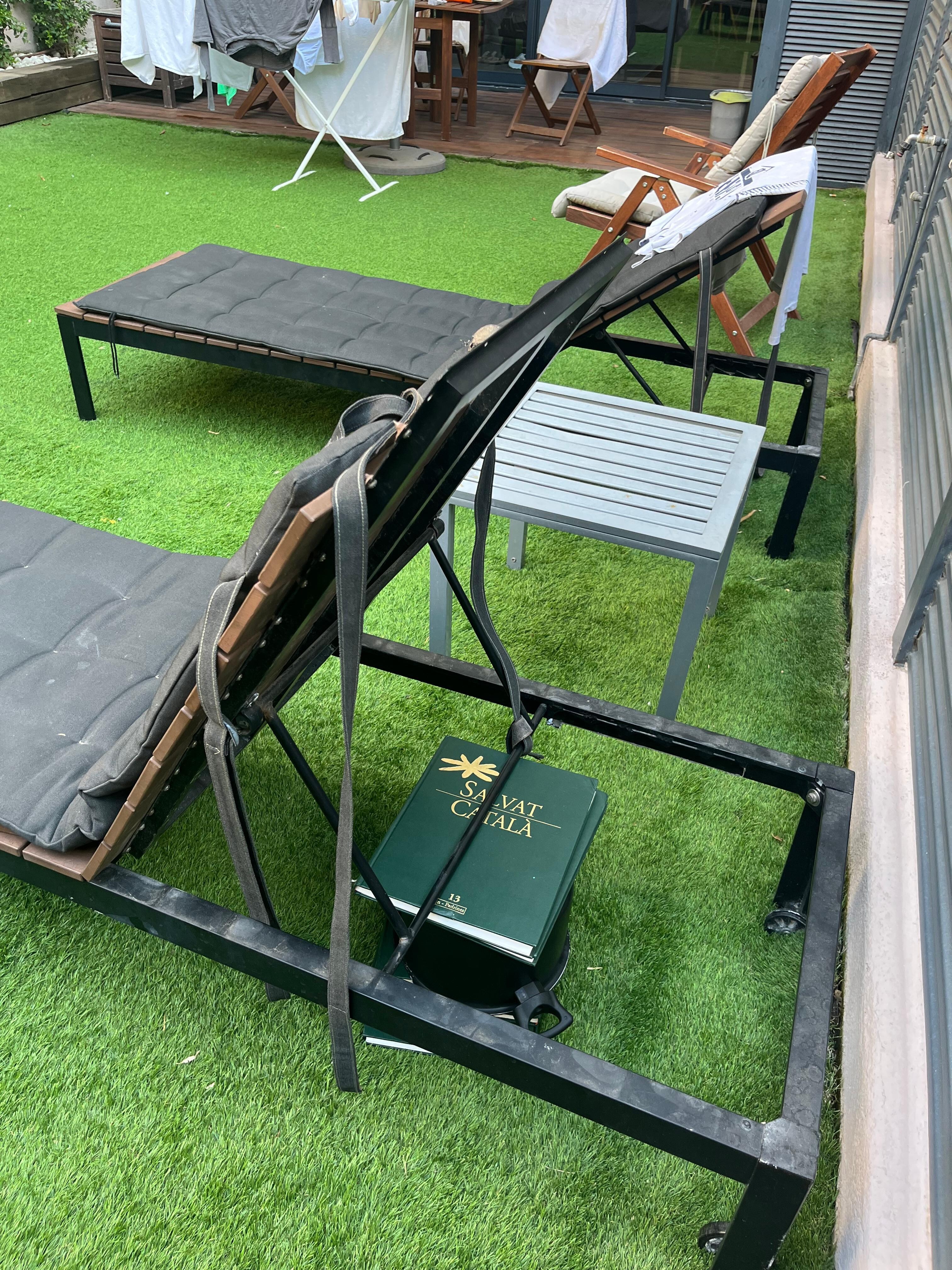 Broken chair.  Used books to make functional.