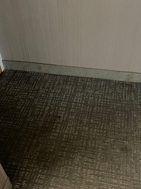 Inside the front door.