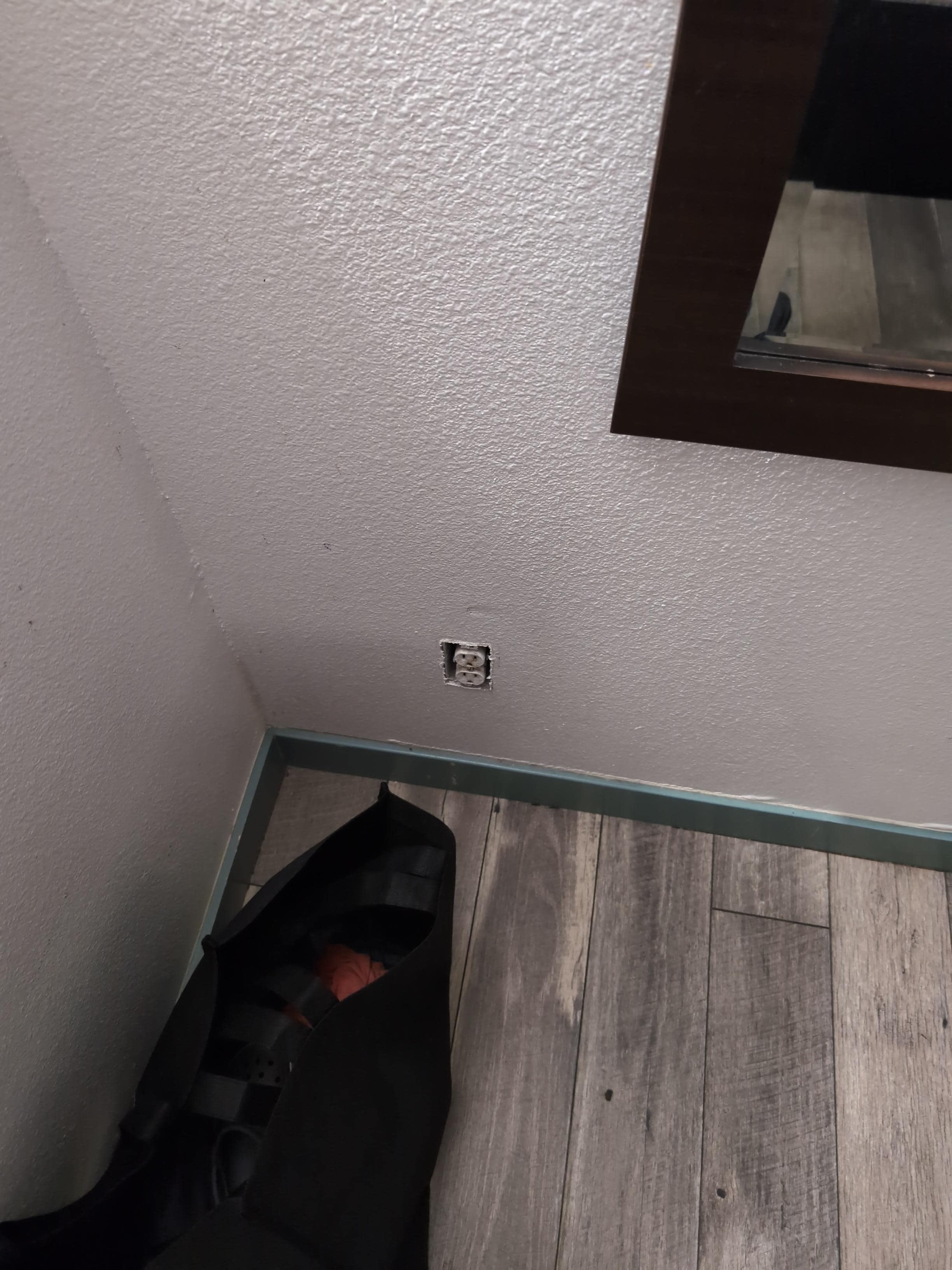 The exposed outlet. Not safe for little ones