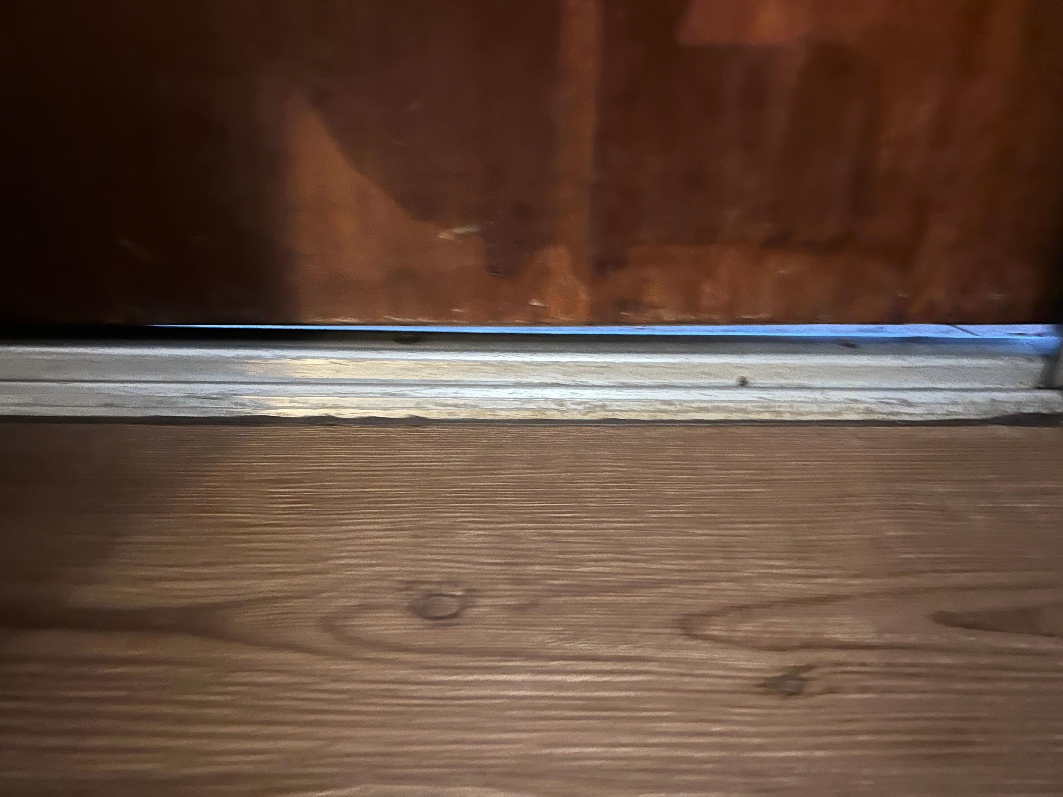 Huge gap under entry door. Won’t let me share the video how bad the slant was in room the golf ball took off running. 