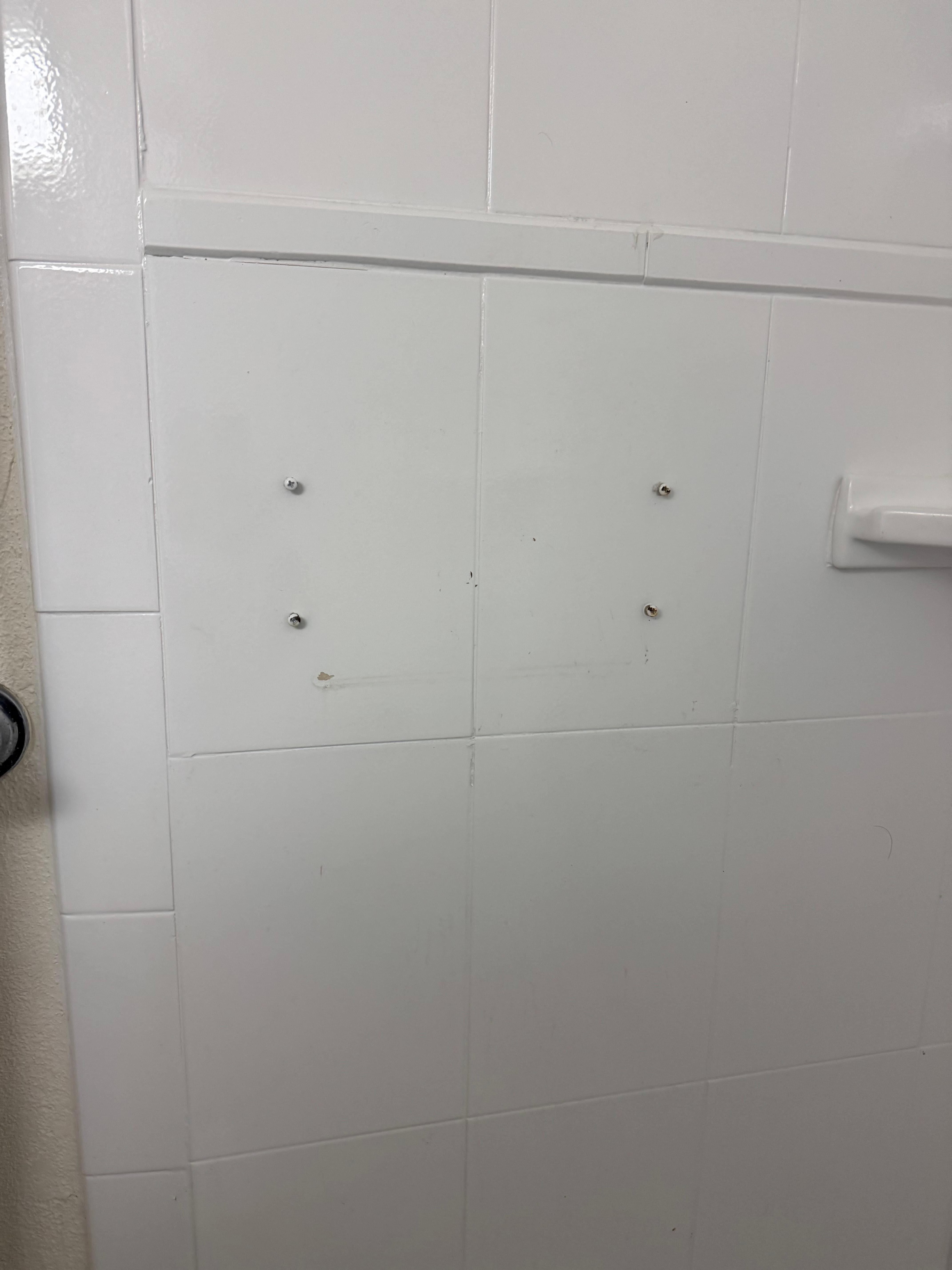 Screws sticking out of the shower 