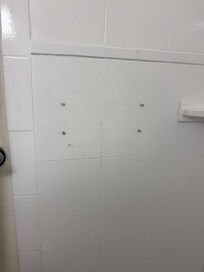Screws sticking out of the shower